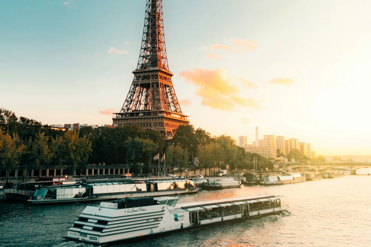 River cruise boat sailing beside the Eiffel Tower in Paris