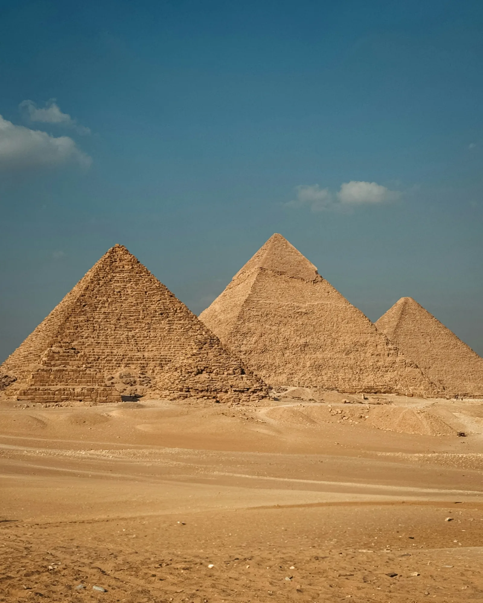 The three pyramids of Giza rising from the Egyptian desert